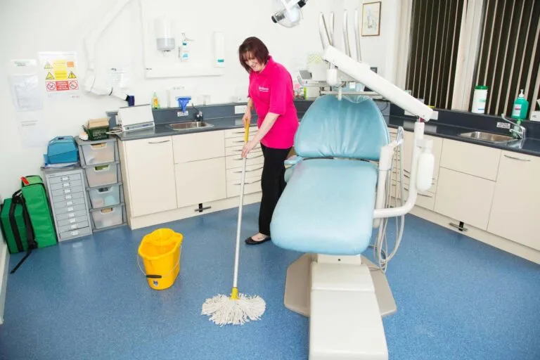 Professional cleaner sanitizing a medical and dental clinic in Edmonton and Calgary – Ecora Cleaning”